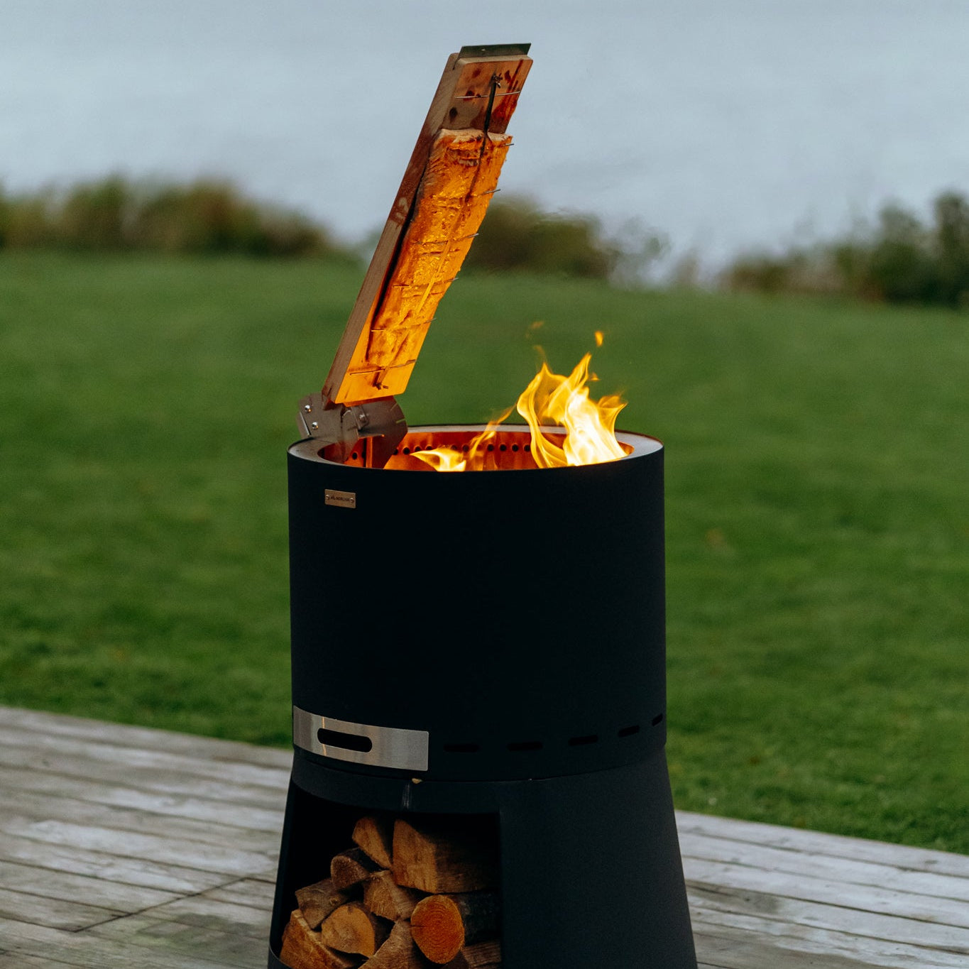 Flame salmon board for fire bowl